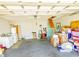 Spacious garage with a washer and dryer, suitable for parking and storage, featuring a pull-down attic ladder at 217 Sienna Dr., Little River, SC 29566