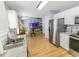 Open concept kitchen with stainless steel fridge and view of adjacent living area at 217 Sienna Dr., Little River, SC 29566