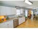 Eat-in kitchen featuring bright white cabinets and stainless steel dishwasher at 217 Sienna Dr., Little River, SC 29566