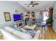 Bright living room featuring a fireplace, comfortable seating, and open access to the entryway at 217 Sienna Dr., Little River, SC 29566