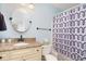 Stylish bathroom featuring granite countertop and patterned shower curtain at 2258 Huntingdon Dr. # B, Myrtle Beach, SC 29575