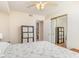 Well-lit bedroom with laminate flooring, a ceiling fan, and an adjacent bathroom offers privacy at 2258 Huntingdon Dr. # B, Myrtle Beach, SC 29575