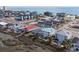 Aerial view of coastal real estate, featuring houses, marshland, and an ocean view at 225-B Dogwood Dr. N, Murrells Inlet, SC 29576