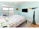 Bedroom featuring light blue walls, access to balcony with great marsh views, and colorful accents at 225-B Dogwood Dr. N, Murrells Inlet, SC 29576