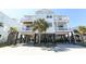 Beautiful stilted beach house with covered parking and multiple decks for enjoying coastal breezes and ocean views at 225-B Dogwood Dr. N, Murrells Inlet, SC 29576