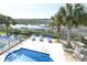Inviting backyard pool area surrounded by tropical plants, lounge chairs, and picturesque marsh views at 225-B Dogwood Dr. N, Murrells Inlet, SC 29576