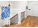 Wooden staircase with stylish railing and accents, offering an elegant transition at 225-B Dogwood Dr. N, Murrells Inlet, SC 29576