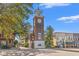 Historic clock tower in downtown with brick base and adjacent commercial building at 227 Six Mile Creek Dr., Georgetown, SC 29440