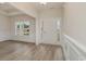 Inviting foyer with gleaming hardwood floors, wainscoting, and a bright, welcoming entrance at 227 Six Mile Creek Dr., Georgetown, SC 29440