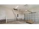 Spacious garage with stairs to attic storage, automatic garage door, and concrete floor at 227 Six Mile Creek Dr., Georgetown, SC 29440