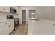Kitchen with quartz counters, stainless appliances, white cabinets, and subway tile backsplash at 227 Six Mile Creek Dr., Georgetown, SC 29440