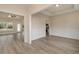 Open-concept living room with hardwood floors, wainscoting, and easy access to kitchen at 227 Six Mile Creek Dr., Georgetown, SC 29440