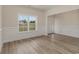 Inviting living room with beautiful trim work, large windows offering lots of natural light, and hardwood flooring at 227 Six Mile Creek Dr., Georgetown, SC 29440