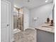 Modern bathroom with a tiled shower, granite vanity, and neutral color scheme for a clean and inviting space at 2418 Goldfinch Dr., Myrtle Beach, SC 29577