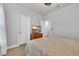 Bright bedroom with TV on wooden dresser; open door leads to another room at 2418 Goldfinch Dr., Myrtle Beach, SC 29577