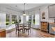 Bright breakfast nook with large windows and cozy seating, perfect for Gathering meals at 2418 Goldfinch Dr., Myrtle Beach, SC 29577