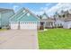Charming single Gathering home with a three car garage, pristine landscaping, and a cozy front porch at 2418 Goldfinch Dr., Myrtle Beach, SC 29577