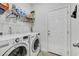 Functional laundry room with modern washer and dryer and shelving for storage at 2418 Goldfinch Dr., Myrtle Beach, SC 29577