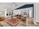 Bright living room featuring an open floor plan, hardwood floors, and a large ceiling fan at 2418 Goldfinch Dr., Myrtle Beach, SC 29577