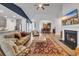 Spacious living room featuring an open floor plan, hardwood floors, and a cozy fireplace at 2418 Goldfinch Dr., Myrtle Beach, SC 29577
