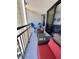 Relax on the private balcony with comfortable seating and views of the surrounding landscape and partial ocean view at 2710 N Ocean Blvd. # 1038, Myrtle Beach, SC 29577