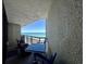 Enjoy outdoor dining with ocean views on the spacious balcony, featuring a table and comfortable chairs at 2710 N Ocean Blvd. # 1038, Myrtle Beach, SC 29577
