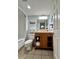 Guest bathroom with vanity cabinet for storage and shower and tub combo with beach themed decor at 2710 N Ocean Blvd. # 1038, Myrtle Beach, SC 29577