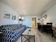Cozy living room with stylish patterned sofa, dining area, and direct access to a well-equipped kitchen at 2710 N Ocean Blvd. # 1038, Myrtle Beach, SC 29577