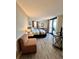 Bright bedroom with balcony access, featuring a king bed and sitting area for relaxation at 2710 N Ocean Blvd. # 1038, Myrtle Beach, SC 29577