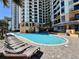 Large outdoor pool with many chairs in a beautiful area by the hotel at 2710 N Ocean Blvd. # 1038, Myrtle Beach, SC 29577