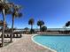 Beautiful beachside pool with lounge chairs and palm trees at 2710 N Ocean Blvd. # 1038, Myrtle Beach, SC 29577