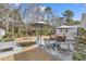 Inviting backyard patio with comfortable seating and landscaped areas at 3065 Moss Bridge Ln., Myrtle Beach, SC 29579