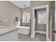 Modern bathroom with a standalone tub and neutral color scheme at 3065 Moss Bridge Ln., Myrtle Beach, SC 29579