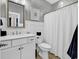 Bright bathroom features a white vanity, modern fixtures, and a framed mirror at 3065 Moss Bridge Ln., Myrtle Beach, SC 29579