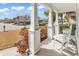Charming front porch with rocking chairs and colorful landscaping at 3065 Moss Bridge Ln., Myrtle Beach, SC 29579