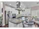 Open concept kitchen features granite counters, white cabinets, and stainless steel appliances at 3065 Moss Bridge Ln., Myrtle Beach, SC 29579