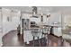 Open concept kitchen features granite counters, white cabinets, and stainless steel appliances at 3065 Moss Bridge Ln., Myrtle Beach, SC 29579