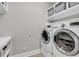 Efficient laundry room includes washer, dryer, and built-in shelves at 3065 Moss Bridge Ln., Myrtle Beach, SC 29579