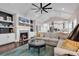 Cozy living room with a fireplace, vaulted ceilings, and adjacent kitchen at 3065 Moss Bridge Ln., Myrtle Beach, SC 29579
