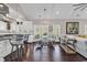 Open concept living space featuring vaulted ceilings, hardwood floors and connected to kitchen at 3065 Moss Bridge Ln., Myrtle Beach, SC 29579