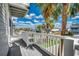Exterior balcony view with white railings, palm trees, and a charming neighborhood setting at 321 52Nd Ave. N, North Myrtle Beach, SC 29582