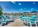 Waterfront deck area featuring a dining table and chairs overlooking the serene canal at 321 52Nd Ave. N, North Myrtle Beach, SC 29582