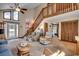 Cozy living room with staircase, comfortable seating, and plenty of natural light, creating a welcoming atmosphere at 321 52Nd Ave. N, North Myrtle Beach, SC 29582