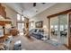 Bright living room with a vaulted ceiling, multiple windows, and comfortable seating, perfect for relaxation at 321 52Nd Ave. N, North Myrtle Beach, SC 29582