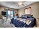 Comfortable main bedroom with a king-size bed and balcony access, adorned with blue accents at 321 52Nd Ave. N, North Myrtle Beach, SC 29582