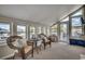 Cozy sunroom with wicker seating, multiple windows, and access to an outdoor balcony at 321 52Nd Ave. N, North Myrtle Beach, SC 29582