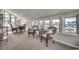 Bright sunroom featuring wicker furniture and multiple windows offering serene views at 321 52Nd Ave. N, North Myrtle Beach, SC 29582