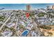 Aerial view of a condominium community with a pool, tennis court, and stunning beach and ocean views at 351 Lake Arrowhead Rd. # 12-347, Myrtle Beach, SC 29572
