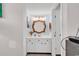 Charming bathroom showcasing a decorative mirror, white vanity, and ample lighting at 351 Lake Arrowhead Rd. # 12-347, Myrtle Beach, SC 29572