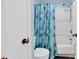 Close-up of a well-maintained bathroom shower featuring a light blue seashell-themed shower curtain at 351 Lake Arrowhead Rd. # 12-347, Myrtle Beach, SC 29572